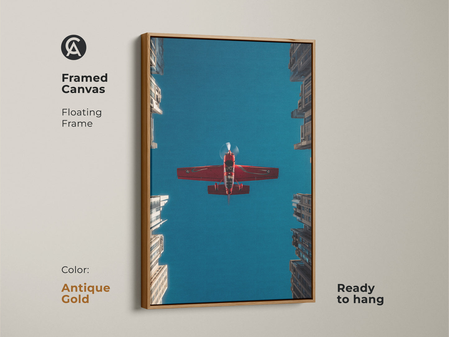 Framed canvas featuring a red aeroplane soaring in a deep blue sky over urban skyscrapers. The floating frame is antique gold. This aviation art print brings a contemporary feel. This is ready to hang and perfect as an aviation enthusiast gift.