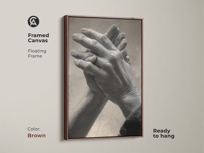 Brown framed canvas featuring intertwined hands art print. The floating frame complements the monochrome palette. It's a unique anniversary gift idea. Perfect for adding a romantic touch to your bedroom decor.