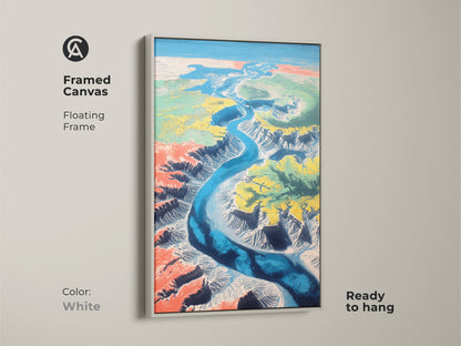 The framed canvas in white features a floating frame. It displays an abstract aerial view of a teal blue river canyon. This unique landscape wall hanging is ready to hang. It is great as home decor.