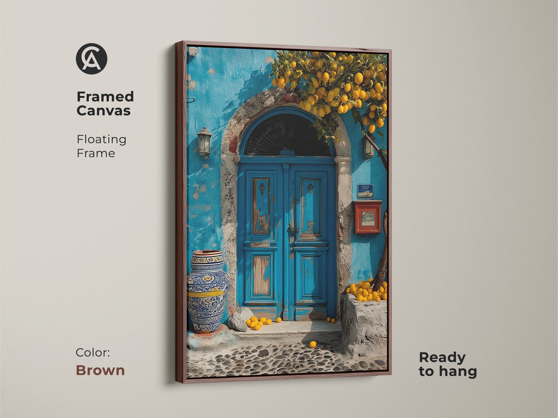 Framed Canvas features a Mediterranean blue door and lemon tree. The floating frame is brown. This boho coastal art is a travel lovers gift. Ready to hang this azure and yellow artwork adds a touch of Mediterranean charm to your home.