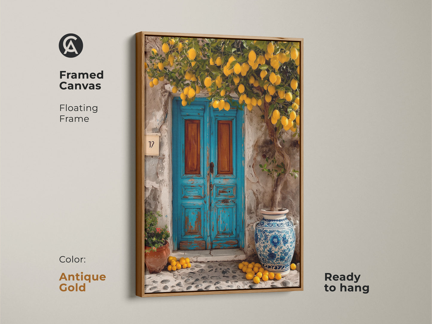 Framed canvas art with an antique gold floating frame showing a lemon tree and blue door. The ready-to-hang Mediterranean artwork adds a rustic and sunny touch. This boho wall decor is perfect for a kitchen or entryway. It is a travel-inspired gift.
