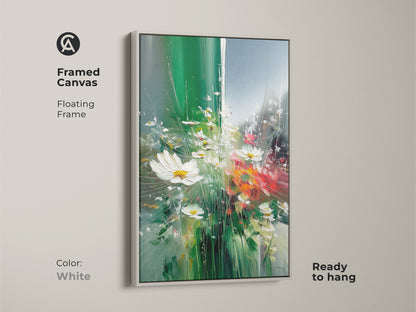 Framed canvas print featuring impressionistic daisies. White floating frame complements the emerald green wildflower artwork. This botanical nature wall art is ready to hang. It adds an eclectic touch. Perfect spring floral wall decor.