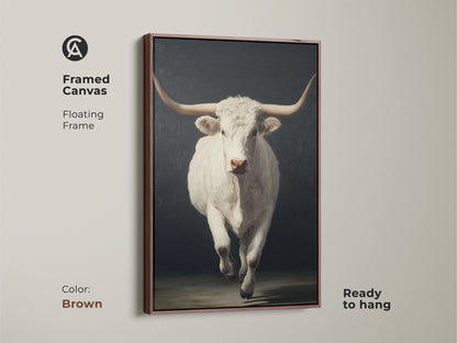 Framed canvas view of the realistic white longhorn canvas art. The floating frame is brown. The farmhouse cattle print comes ready to hang. This rustic animal home decor is great modern farmhouse wall art.