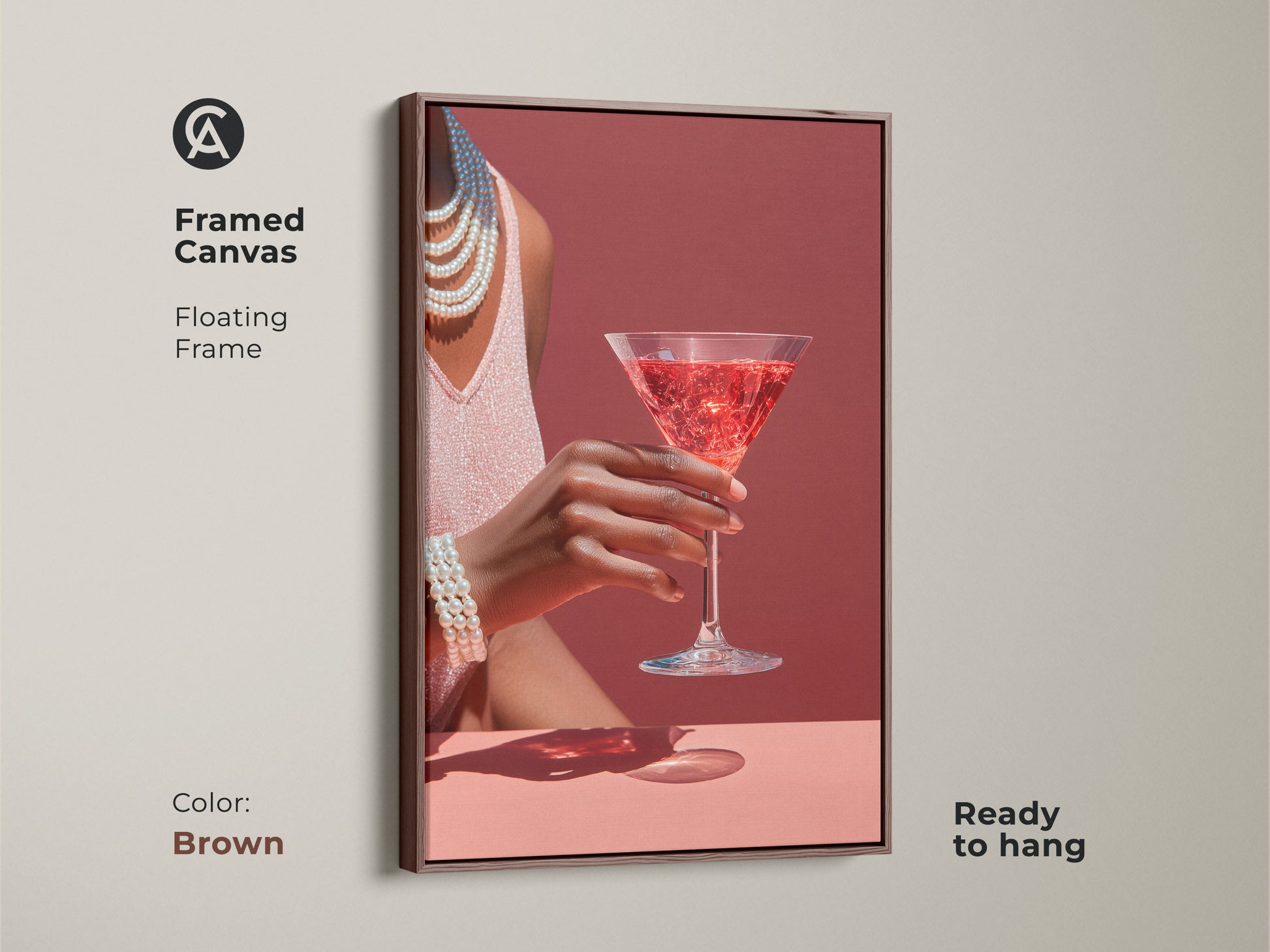 Brown framed canvas featuring a rose martini cocktail. It is glamour bar area wall art. The pearl necklace accent art in art deco style cocktail decor adds to any kitchen. This contemporary piece is ready to hang.