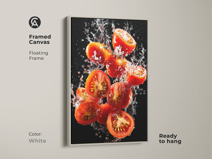 Framed canvas art featuring splashing tomatoes. White floating frame gives a clean modern look. Ready to hang this artwork is vibrant. It is perfect for kitchen or dining room decor. The white frame enhances the colors. This art adds a touch of freshness.
