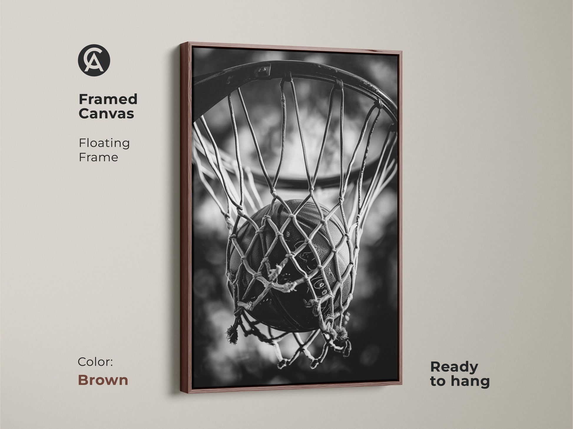 Brown framed basketball canvas art. This floating frame canvas is ready to hang. The brown frame enhances the black and white artwork of a basketball in a net. Ideal for sports enthusiasts and home decoration.