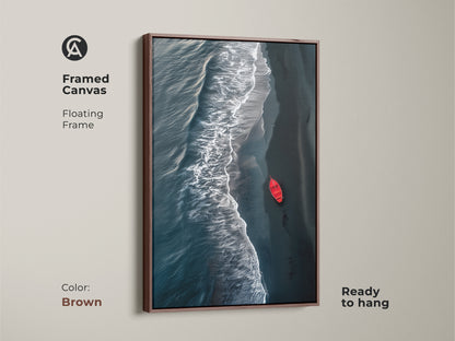 Framed minimalist ocean art. Aerial view of deep teal coastal waves and a striking red boat artwork. Perfect beach wall decor for coastal homes. The print brings modern seascape serenity to any room. A great housewarming gift for ocean lovers. Brown frame.