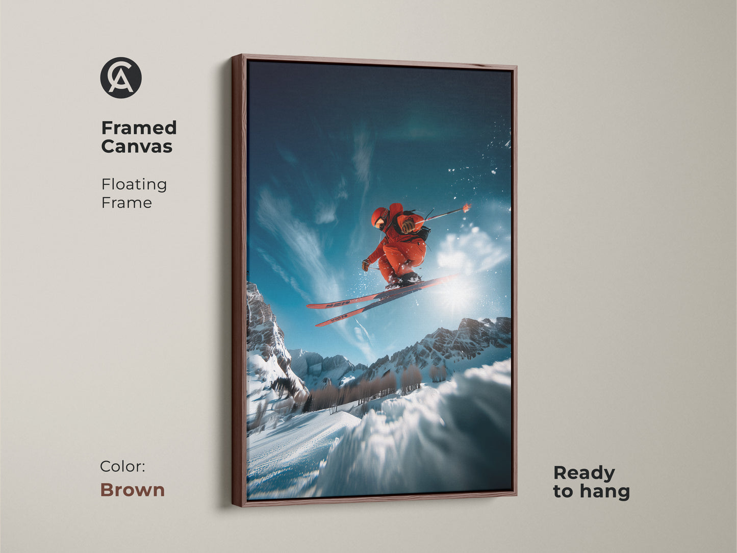 Framed canvas art of a skier in mid-air. The floating frame has a brown finish. This piece is ready to hang and showcases a dynamic winter scene. Ideal for adding a sporty touch to any room. The high-quality canvas ensures lasting beauty.