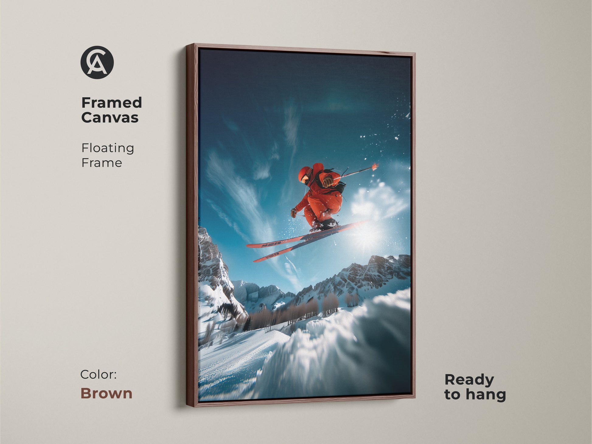 Framed canvas art of a skier in mid-air. The floating frame has a brown finish. This piece is ready to hang and showcases a dynamic winter scene. Ideal for adding a sporty touch to any room. The high-quality canvas ensures lasting beauty.