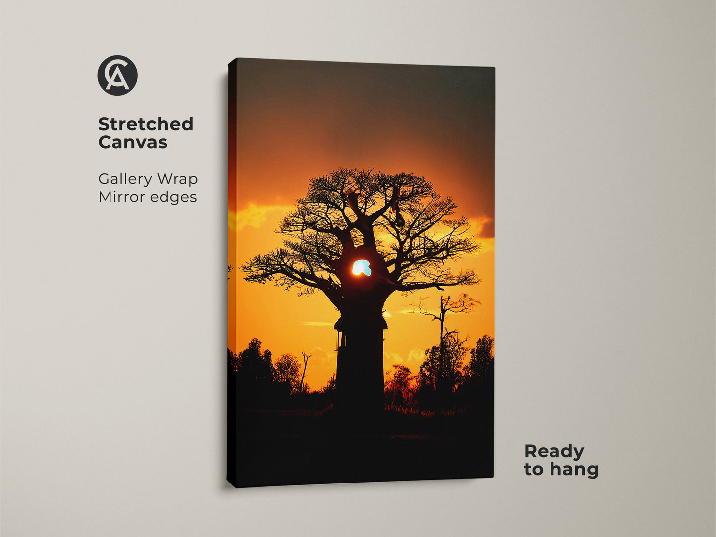 Stretched canvas featuring a silhouetted african sunset. Gallery wrapped with mirrored edges. It's ready to hang. The baobab tree canvas print makes a bold statement. Perfect eclectic home wall art for a travel inspired space. The orange and yellow hues bring the savanna sunset to your walls.