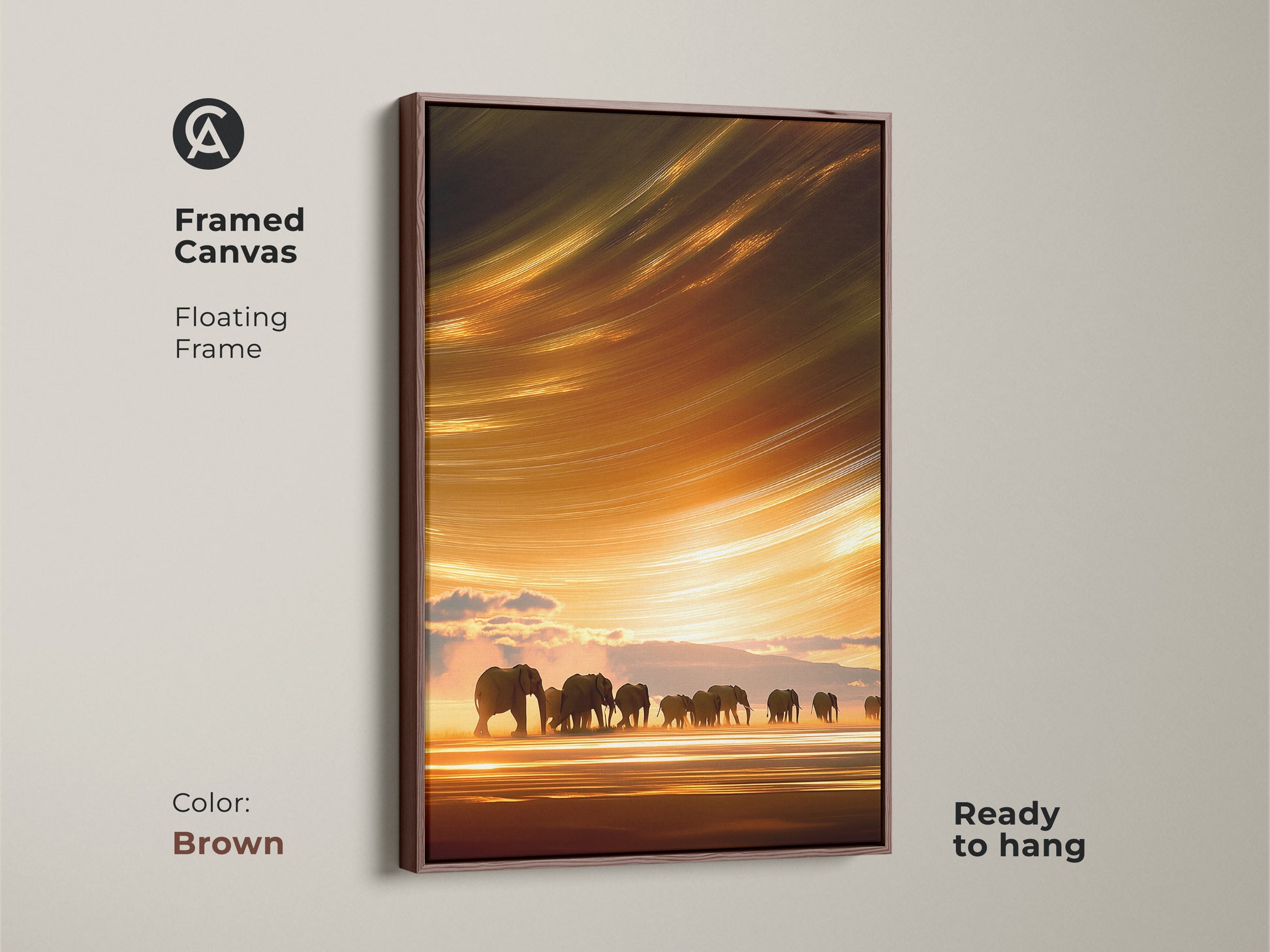 Framed canvas art displays elephants on a savanna at sunset with a brown floating frame. This abstract impressionistic print has warm orange yellow gold hues. A beautiful wildlife artwork ready to hang in your home.