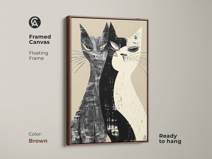 Framed canvas of a Mid-Century Modern cat art with a floating frame in brown. This unique pet art features two cats in a black and white linocut style. It's a ready-to-hang stylish home art for living rooms or bedrooms.
