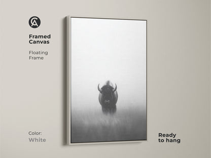 The framed canvas displays a minimalist bison artwork with a white floating frame. This monochrome animal decor is ready to hang adding a modern aesthetic to any room. It's a perfect gift for outdoor enthusiasts looking for unique wall art.