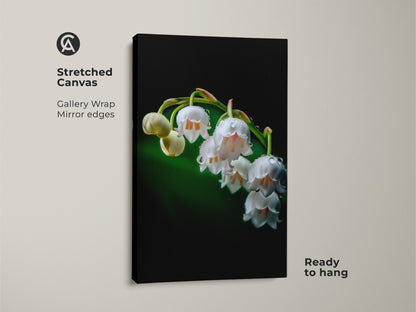 Close-up of a stretched canvas featuring Lily of the Valley artwork. This macro nature photography highlights dewdrops on white petals. A gallery wrap with mirror edges makes it ready to hang. This botanical print adds elegance to any space.