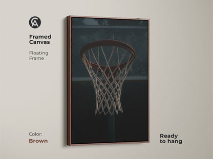 Framed canvas with basketball hoop artwork in a floating frame. The brown frame complements the industrial sports decor. This ready-to-hang game room artwork adds a touch of athletic grit. This dark red basketball art is great for sports fans.