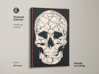 Framed canvas featuring a brown floating frame and a gothic cracked skull. This macabre skull art is ready to hang. It adds a touch of alternative art to any room. Black red and white artwork is a perfect gift for study or office room.