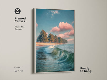 Framed canvas with a white floating frame. Teal pine tree beach art. It features coastal ocean waves. The blue and pink sky landscape is calming. Ready to hang for minimalist home decor. It enhances any residential wall.