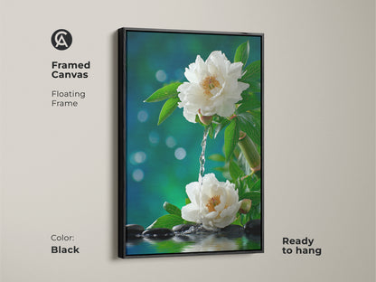Black framed canvas art featuring white peonies and water. This zen inspired artwork is ready to hang. The black floating frame adds a modern touch. Enhance your living space with this calming floral print.