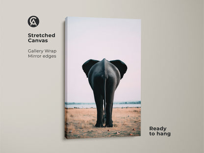 Stretched canvas print of an elephant rear. This gallery wrap features mirror edges for a seamless look. Ready to hang this safari wildlife canvas print brings nature indoors. The photorealistic elephant art adds a contemporary touch. Ideal for minimalist decor. Enhance your home with this unique animal artwork.