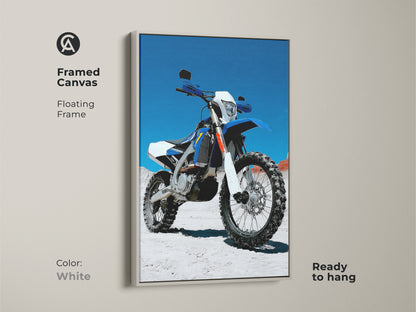Framed canvas in white featuring blue white motocross motorcycle art. This floating frame enhances the motorcycle art. Ready to hang dirt bike wall decor for a garage or man cave. Perfect as a gift for motorcycle enthusiast.