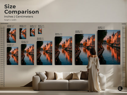 Size comparison of Parisian cityscape art in a living room setting. The Seine River photography is available in multiple sizes. Golden hour lighting highlights Parisian buildings. This canvas art brings contemporary French decor to your home. Find the perfect fit today. Consider it as Francophile gift.
