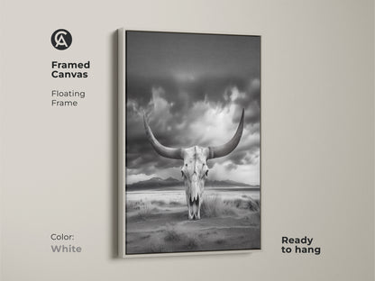 Framed canvas showcasing a longhorn skull against a desert backdrop. This white framed art offers a minimalist western decor piece. The monochrome animal skull artwork is ready to hang. This unique wall hanging is perfect for a man cave. The ethereal desert landscape is captivating.