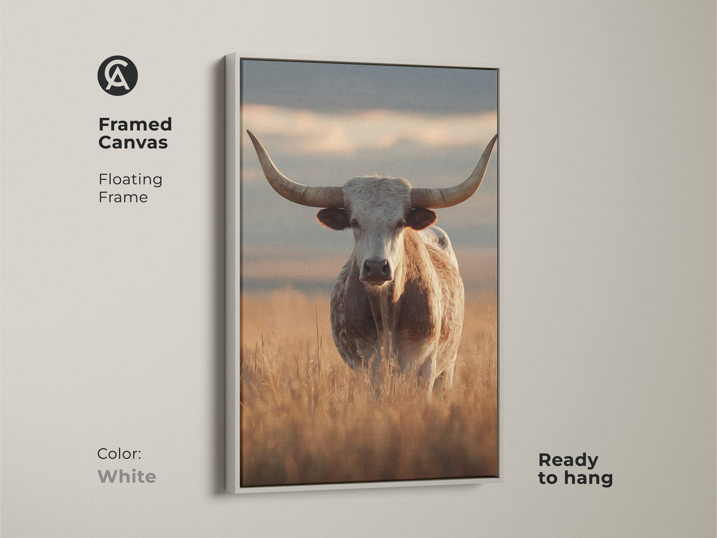 Framed canvas featuring a longhorn cattle in a rustic Tuscan setting. The white floating frame highlights this farmhouse animal artwork. This piece is perfect for beige neutral wall art and easy to hang.