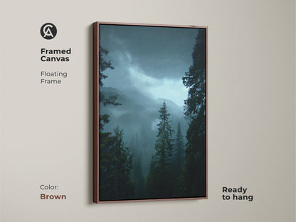 Framed canvas print of a misty forest landscape with a brown frame. This pine tree art brings deep green nature into your home. Ready to hang this artwork offers a tranquil mountain view. Ideal rustic wall decor.