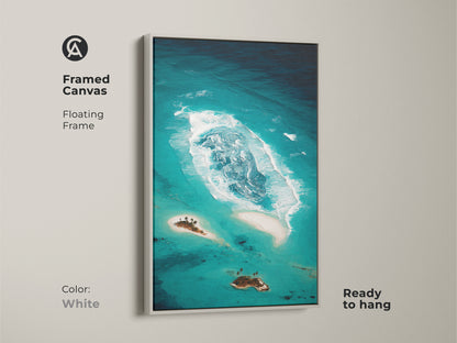Framed canvas of an abstract teal ocean is ready to hang. The white floating frame highlights the coastal island artwork. This tropical beach landscape features deep teal aqua tones. This turquoise ocean art offers a clean modern look.