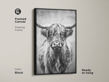 A framed canvas features a monochrome Highland Cow. The black floating frame enhances the black and white animal artwork. Ready to hang this rustic wildlife art adds farmhouse charm. A perfect gift for cow lovers.