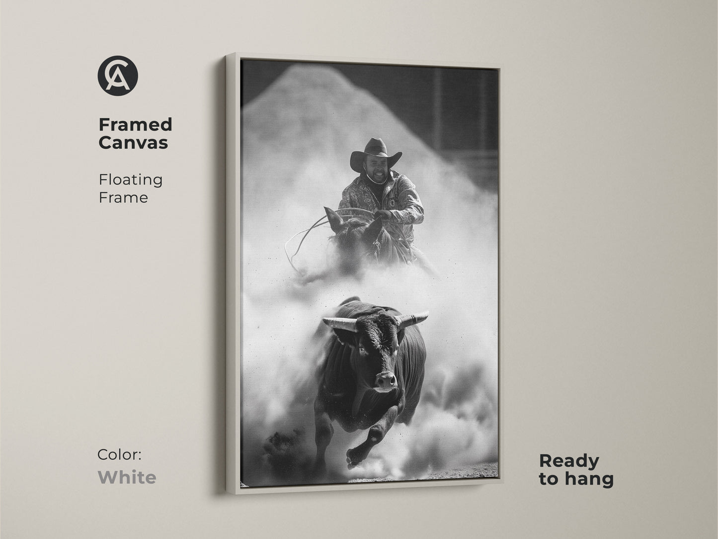 Framed Canvas of a Monochrome Rodeo scene in a white floating frame. This Western wall art features a bull rider and charging bull. The rustic cowboy decor is ready to hang. Perfect for a man cave or office. This adrenaline art print captures the spirit of the rodeo.