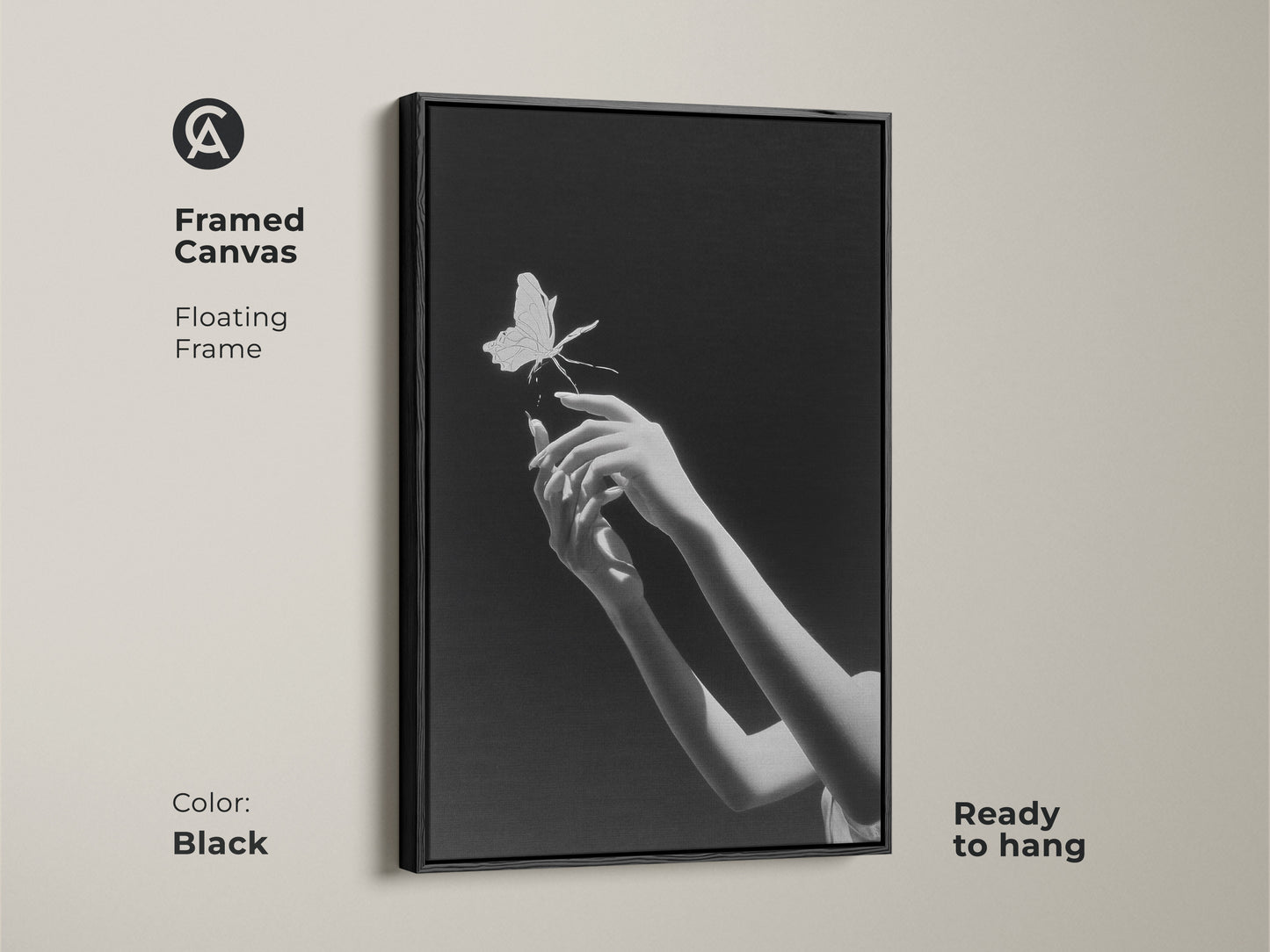 Framed canvas featuring surreal hands reaching for a butterfly in monochrome. This minimalist black art is ready to hang. The floating frame adds a contemporary touch to the elegant insect artwork. This contemporary bedroom wall art is perfect for modern home decor. Its frame is in the color black.