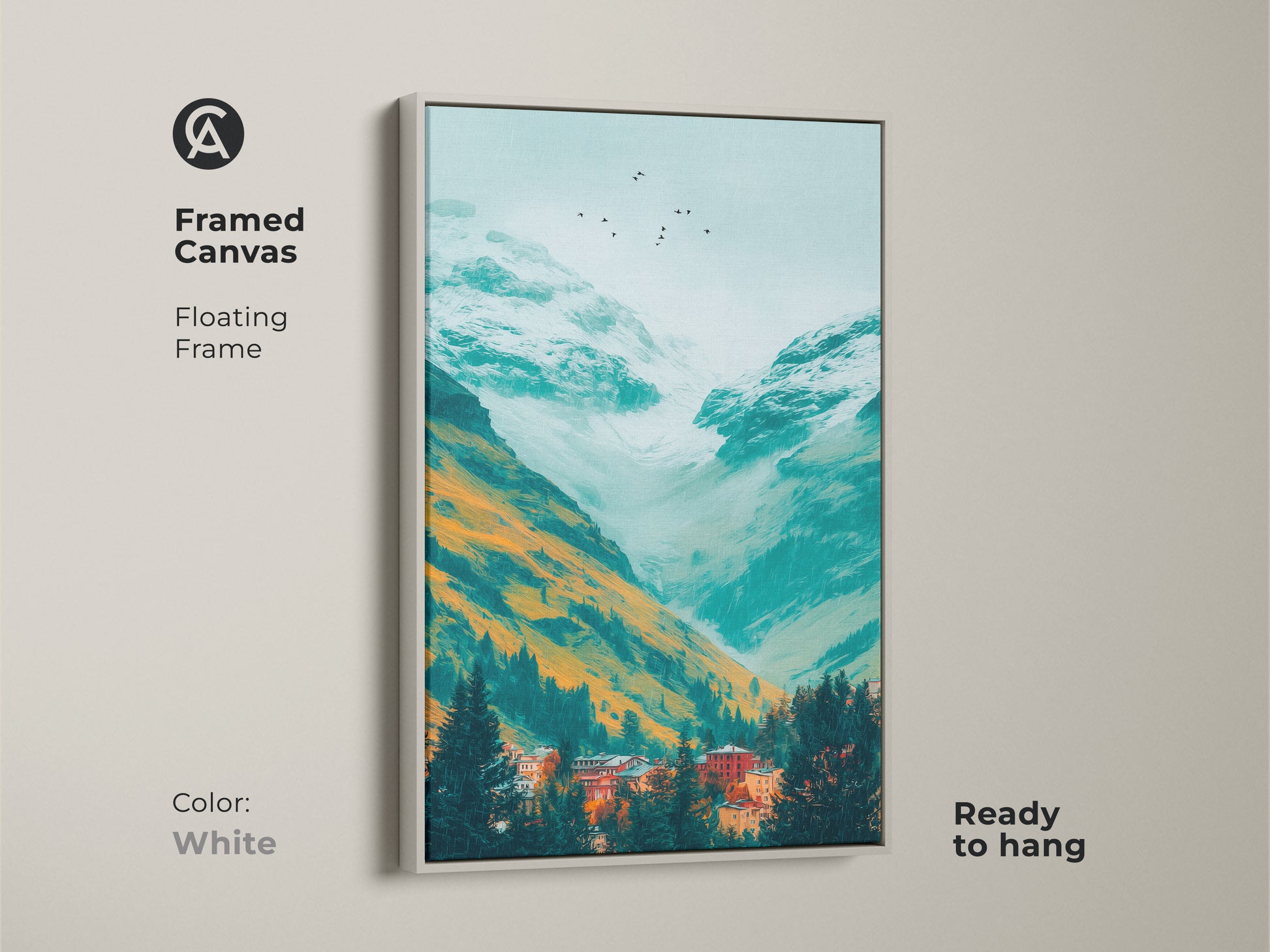 A framed canvas print displays a teal mountain valley artwork. Orange and white mountains tower over a village nestled in evergreens. Birds fly in the misty sky. This framed art is a clean white color.