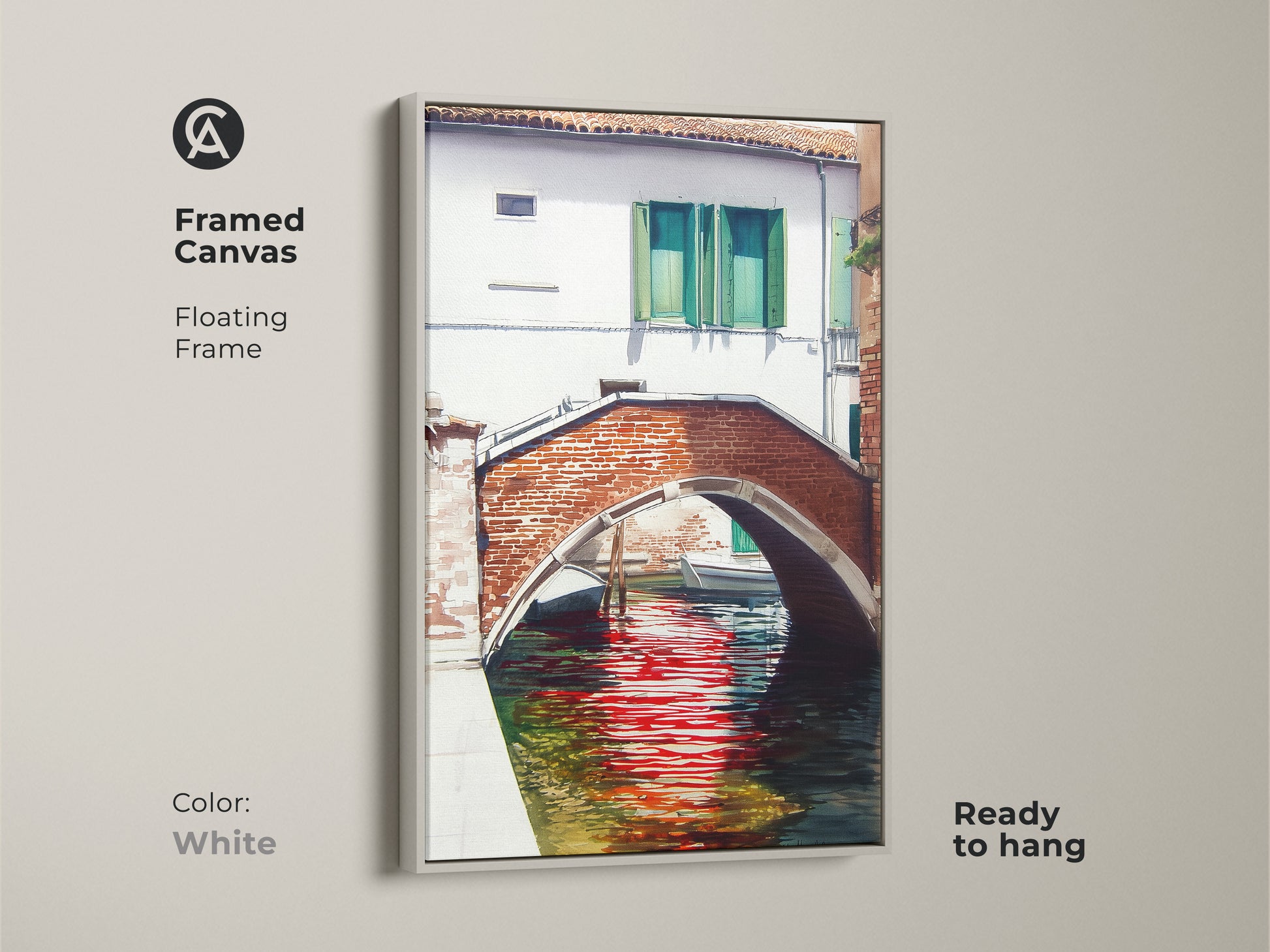 Framed canvas art displays a Venice canal scene with a brick bridge and red reflections. The white floating frame offers a clean look to the traditional artwork. Ready to hang and complements any decor.
