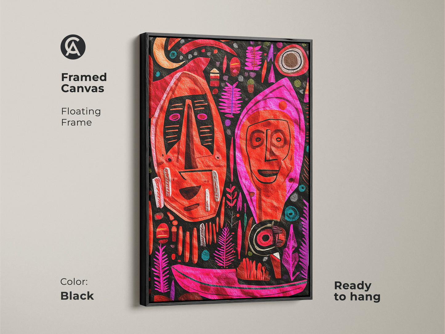 The framed canvas displays abstract figurative wall art with a black floating frame. The artwork shows tribal masks in red pink and magenta. Its folk art style is perfect for art collectors and eclectic home decor.