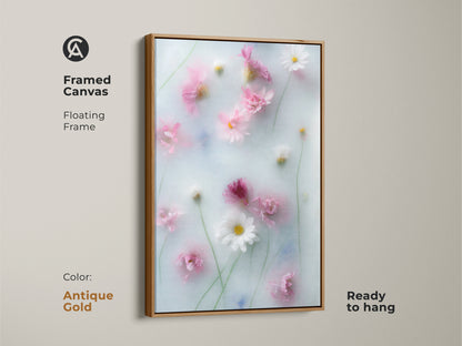 Framed canvas of soft focus pink daisy and cosmos flowers botanical art. This dreamy artwork with an antique gold floating frame is ready to hang. Pastel blue wall art brings a Scandinavian touch. It's a gentle flower artwork for home decor.