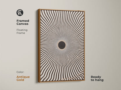 Framed canvas featuring an intriguing geometric artwork. The floating frame enhances the black and white radial burst. It is ready to hang. The antique gold frame complements minimalist home decor. It adds a modern touch to any room.