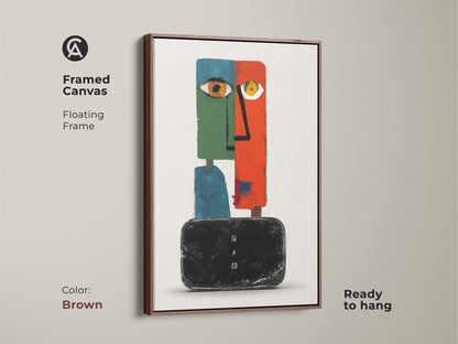 Framed canvas of a modern abstract face artwork with a floating brown frame. This surreal wall decor features an eclectic orange green and teal color palette. The figurative geometric canvas art is ready to hang. A perfect addition to a bedroom or living room. This contemporary wall art adds sophistication to any space.