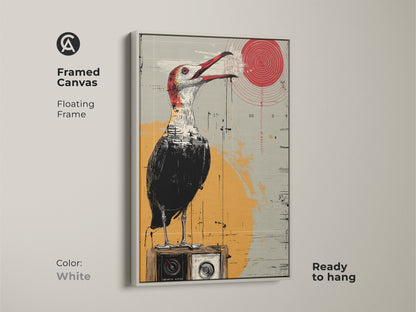 Framed canvas with a white floating frame presents surreal bird artwork. This eclectic art piece shows a bird on a vintage radio perfect for modern spaces. Red yellow grey tones add flair. This ready to hang art is ideal for art collectors a unique gift. Great for enhancing study or office walls with its retro charm.
