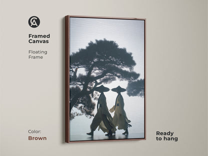 Framed canvas art featuring silhouetted figures under a pine tree. The Japandi wall decor has a floating frame. This dark blue beige canvas is ready to hang in a brown frame. A minimalist home office art or a thoughtful travel gift.