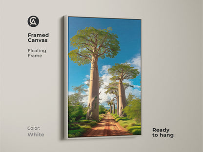 Framed canvas of a boho Baobab tree African landscape with a white floating frame. This nature artwork features a dirt road leading to Baobab trees under a blue sky. It is ready to hang and an outdoor adventure art.