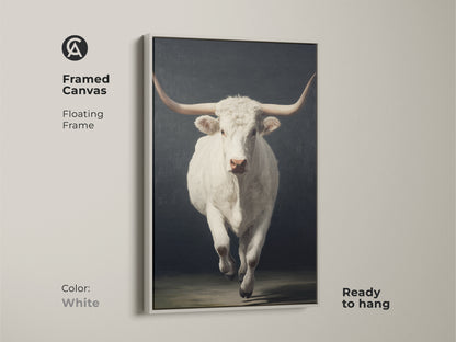 Framed canvas view of the farmhouse longhorn wall art. The floating frame is white. The realistic bull wall decor comes ready to hang. It's a perfect western wildlife artwork for neutral farm animal print lovers.