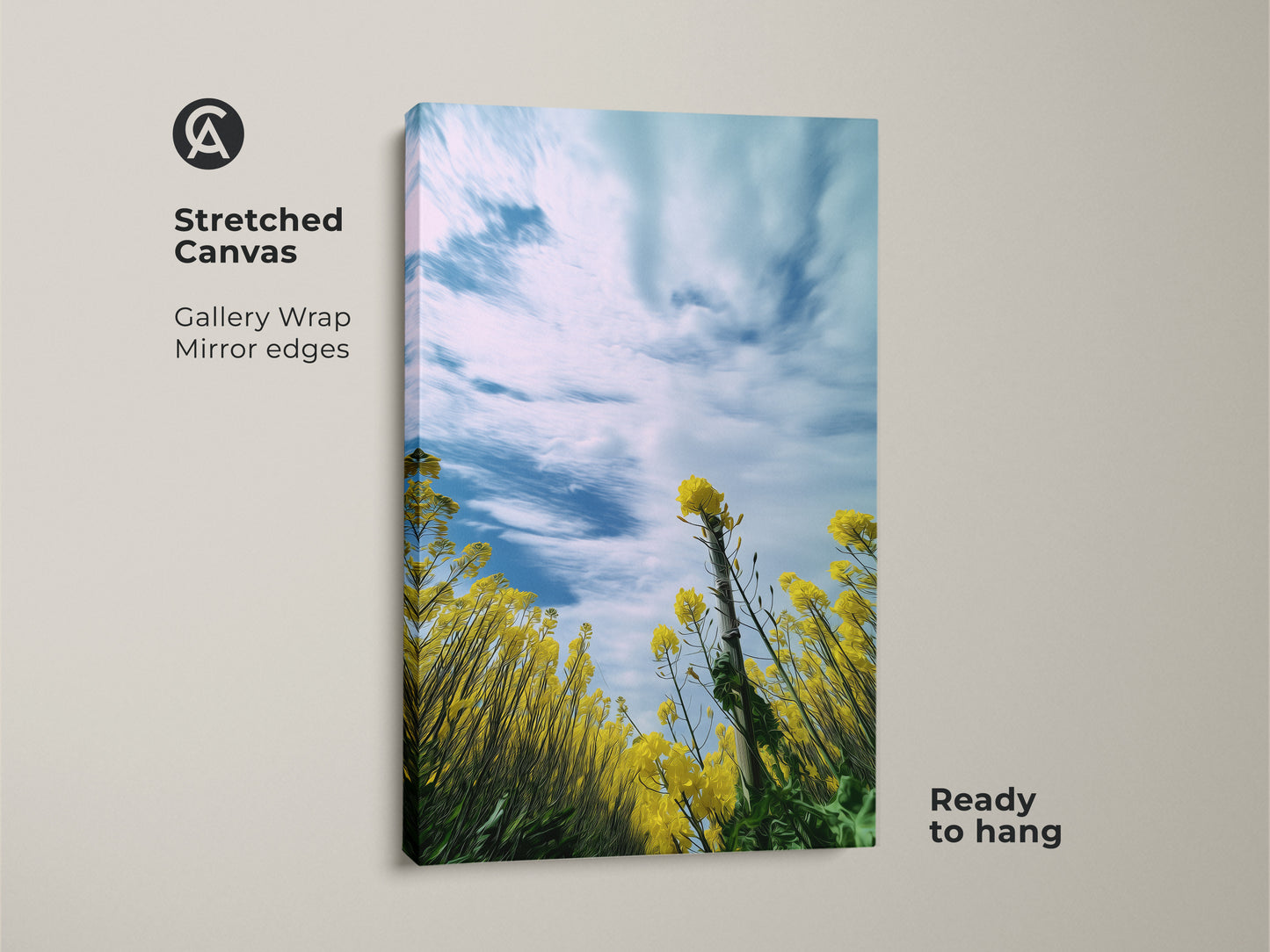 Stretched canvas print of a blooming yellow canola field with a blue sky. The gallery wrap and mirror edges add a modern touch. This spring landscape wall art is ready to hang. Bring the beauty of nature indoors with this vibrant floral canvas. Perfect boho bedroom wall decor.