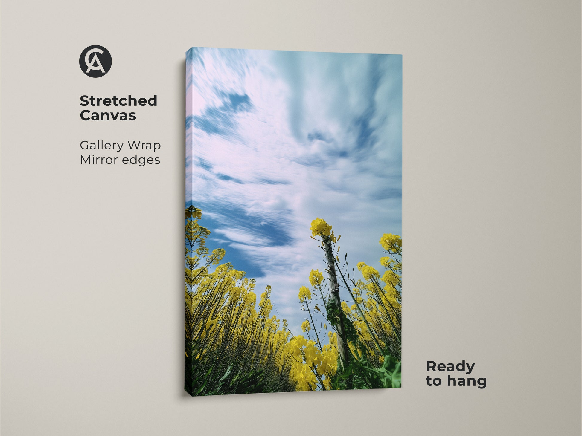 Stretched canvas print of a blooming yellow canola field with a blue sky. The gallery wrap and mirror edges add a modern touch. This spring landscape wall art is ready to hang. Bring the beauty of nature indoors with this vibrant floral canvas. Perfect boho bedroom wall decor.