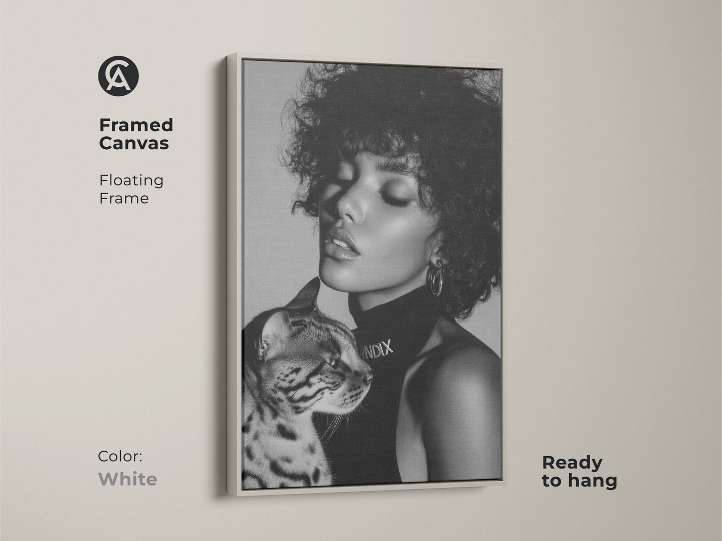White framed canvas featuring a monochrome portrait of a woman with a Bengal cat. This floating frame creates a contemporary and minimalist look. Ready to hang for effortless style. A stylish choice for modern wall art.