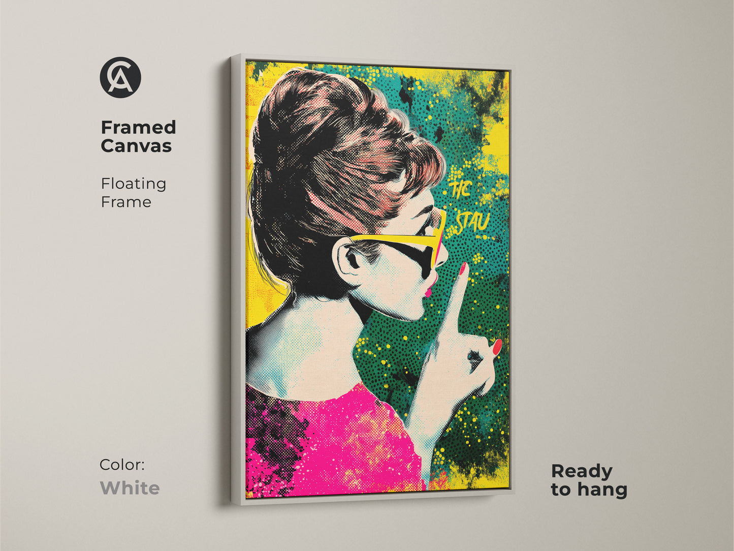 Framed canvas of Audrey Hepburn pop art with a white floating frame. The artwork showcases a retro halftone style in pink yellow and teal. It is ready to hang. Ideal eclectic home decor.