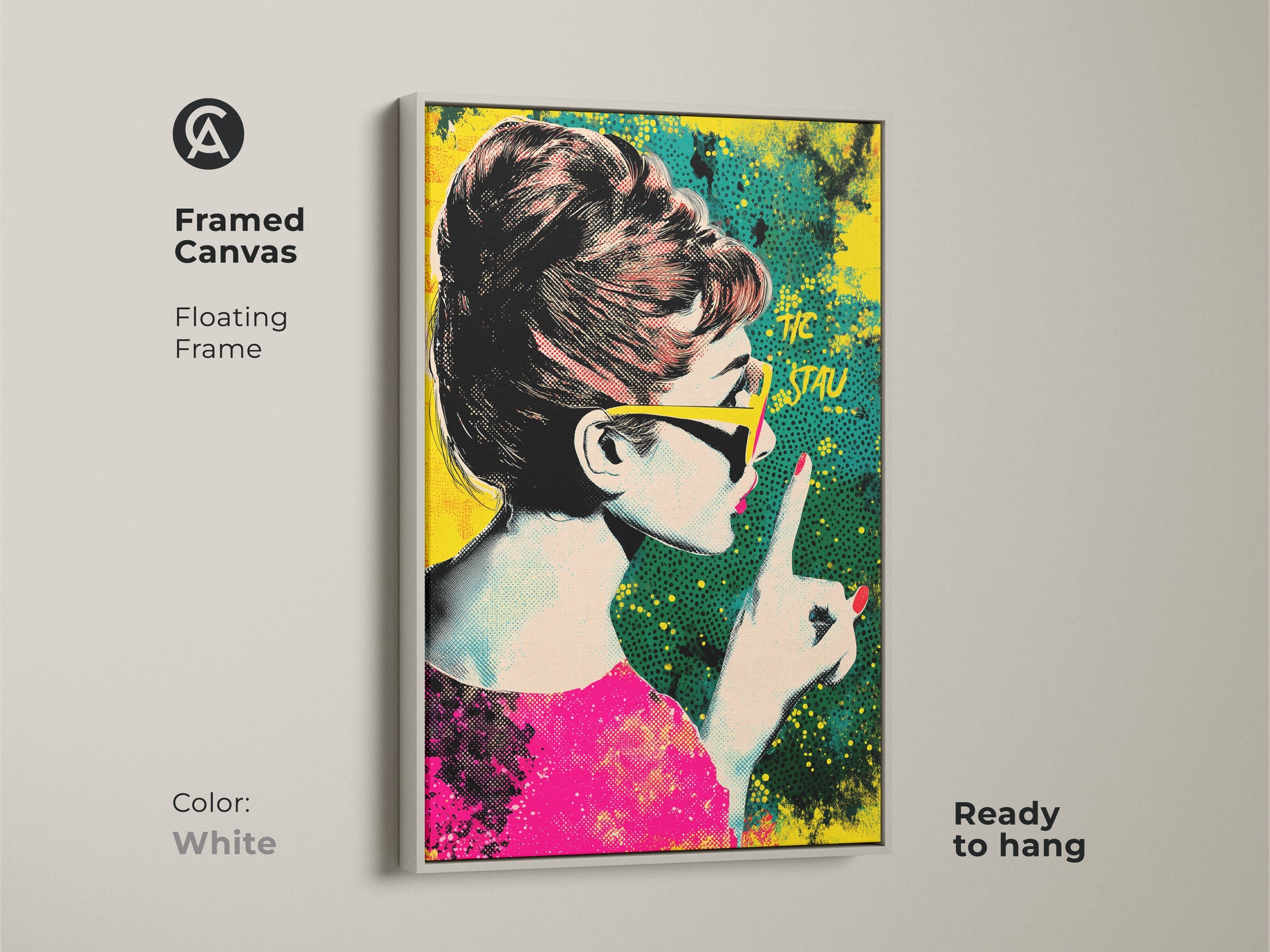 Framed canvas of Audrey Hepburn pop art with a white floating frame. The artwork showcases a retro halftone style in pink yellow and teal. It is ready to hang. Ideal eclectic home decor.
