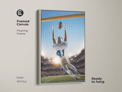 Brighten your space with this framed football catch canvas. This sports action print features a clean white floating frame and is ready to hang. Great sports fan gift.