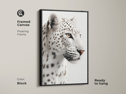 A framed canvas in black displays a monochrome snow leopard up close. Ready to hang this modern wildlife home decor adds sophistication to any room. Perfect wildlife gift for animal lovers art