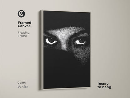 White framed canvas displays monochrome eyes wall art. The abstract face canvas print shows minimalist portrait art. Black and white bedroom decor makes for contemporary living room art. High contrast artwork offers a modern abstract print. This mystery themed art is ready to hang.